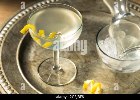 Refreshing Dry Martini with a Lemon Garnish and Vermouth Stock Photo
