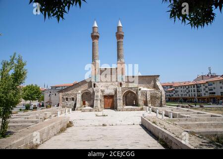 Sivas / Turkey - August 3, 2020, Double Minaret Madrasah was built in 1271 İlhanlı period. The tile decorations on the minarets are remarkable. Sivas, Stock Photo