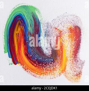 From above concept of multicolored brush strokes of acrylic colors on white canvas Stock Photo