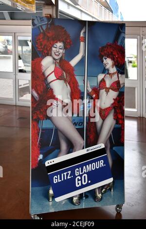 Las Vegas NV, USA 02-10-18 A poster with two beautiful models promoting the Monorail pass card at the Harrah’s / Linq station Stock Photo