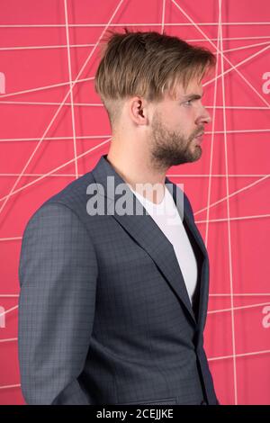 Manager dress code. Man well groomed manager wear elegant formal suit pink background. Manager confident wear perfect outfit. Guy office worker handsome appearance. Guy unshaved office manager. Stock Photo