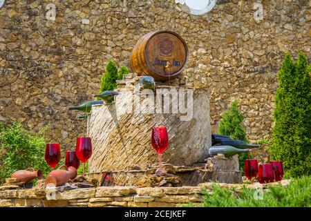 Premium Photo  Decorative fountain in form of pouring wine at the entrance  of milestii mici wine cellars in moldova