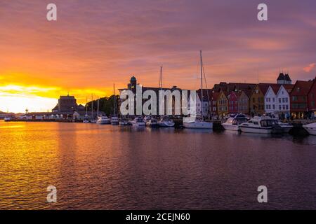 Scenic white night View Famous Bryggen street is a series of Hanseatic commercial buildings lining the eastern side of the harbour in Bergen, Norway. Stock Photo