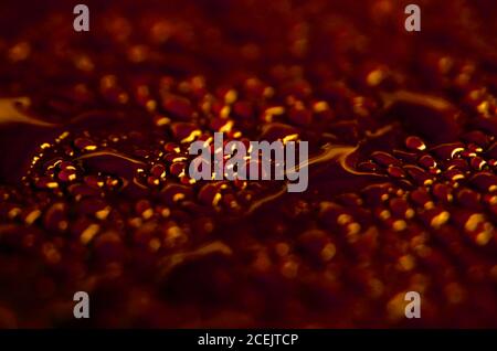 Background of shiny drops on surface in bright red color Stock Photo