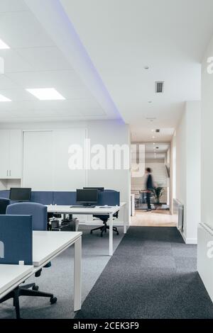 View of anonymous person standing in stylish office area during working day Stock Photo