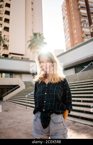 Attractive young Woman standing on street Stock Photo