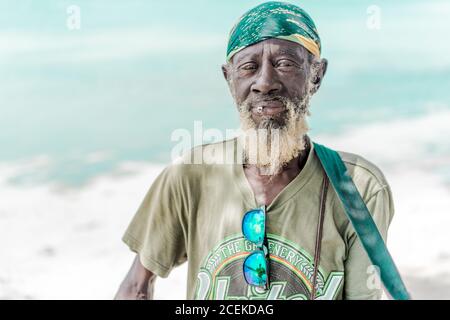 Jamaican man playing guitar Stock Photo
