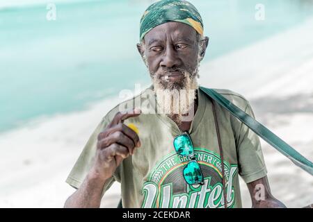 Jamaican man playing guitar Stock Photo