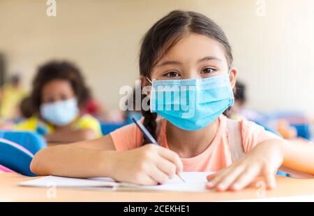 students wearing  mask and  studying in the classroom. Stock Photo