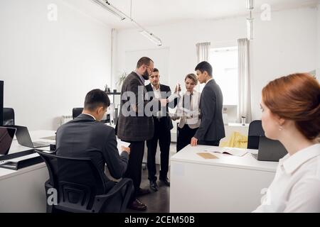 Meeting and brainstorming of business colleagues in the office. Strategy for raising the sales plan and launching a new startup Stock Photo