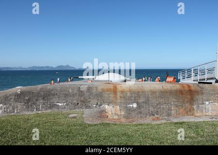 An old cannon in the fort, with the ocean on background. Stock Photo