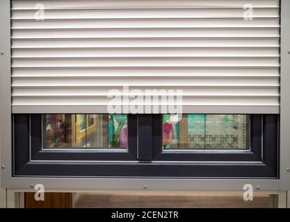 Roller shutters installed on a plastic window Stock Photo