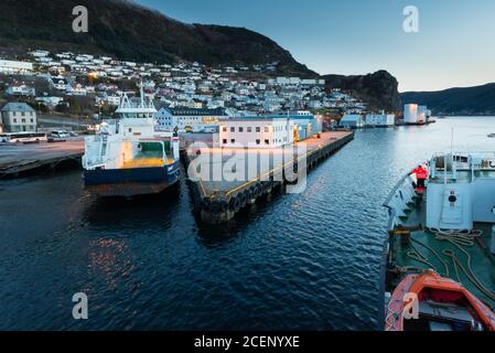 Port of the city Maloy in Norway seen from cruise ship in early morning Stock Photo