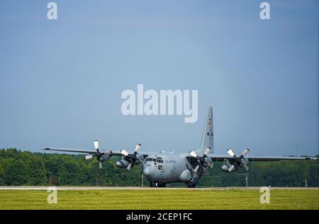 A C-130H Hercules assigned to the 908th Airlift Wing, Maxwell Air Force Base, Alabama, takes off from the flightline on Aug. 23, 2020, at Youngstown Air Reserve Station in Vienna, Ohio. Five Air Force Reserve units from the 22nd Air Force and a West Virginia Air National Guard unit participated in Rally in the Valley, a multi-day C-130 training exercise under a distributed operations concept, Aug. 22-25, 2020. The exercise included cargo drops, high-altitude paratrooper drops, task force resupply and personnel extraction. (U.S. Air Force photo/Airman 1st Class Kelsey L. Martinez) Stock Photo
