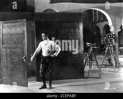 RUDOLPH VALENTINO on set candid portrait during filming of  A SAINTED DEVIL 1924 director JOSEPH HENABERY story Rex Beach Lost Silent Film Famous Players - Lasky Corporation / Paramount Pictures Stock Photo