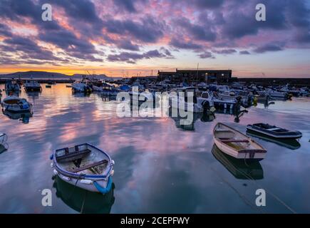 Lyme Regis, Dorset, UK. 2nd Sep, 2020. UK Weather: A beautiful, but moody autumnal sunrise at the coastal resort of Lyme Regis heralds a change in the weather as the glorious summer weather comes to an end. Credit: Celia McMahon/Alamy Live News Stock Photo