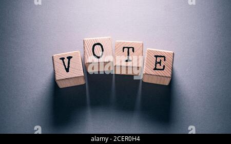 Vote Word Written on Wooden Cubes Stock Photo