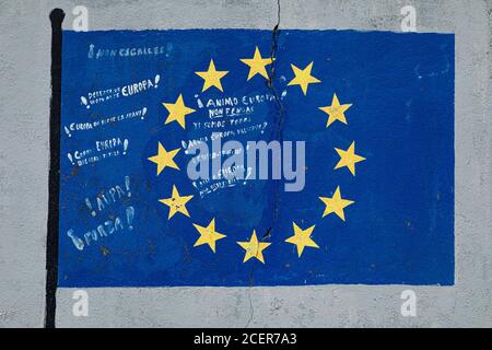 Flag of the European Union, with messages of encouragement, painted on a gray wall on Rua do Porto in the town of Vicedo, Lugo, Spain. Stock Photo