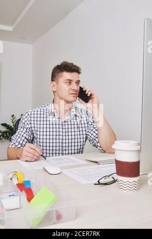 UI designer calling to client Stock Photo