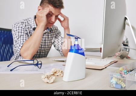 Hand sanitizer on desk Stock Photo