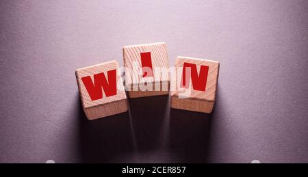 Win Word Written on Wooden Cubes Stock Photo
