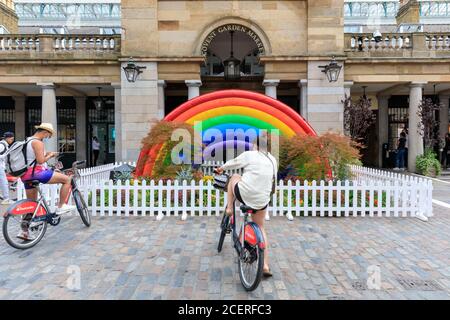 Large inflatable rainbow display for Pride month in Covent Garden, London, England, UK Stock Photo