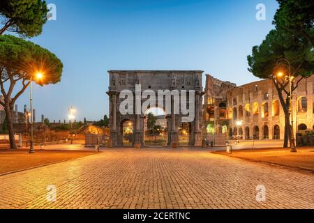 Arch of Constantine and Colosseum at sunrise, Rome, Italy Stock Photo