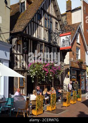 Tourists enjoying the cafes and pubs of George Street in Hastings Old Town, East Sussex, England UK 2020 - Hastings street Sussex Stock Photo