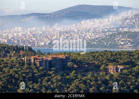 High angle view of Buyukada Prinkipo Greek Orthodox Orphanage and Maltepe district in the background in Istanbul, on August 29, 2020. Stock Photo