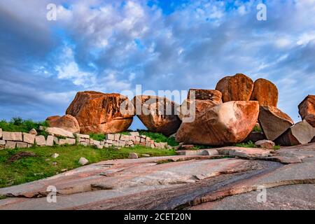 carving stone of hampi ruins with bright blue sky background image is taken at hampi karnataka india.