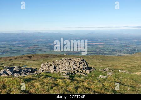 The Eden Valley and the Distant Mountains of the Lake District Viewed from the Slopes of Cross Fell on the Pennine Way, Cumbria, UK Stock Photo