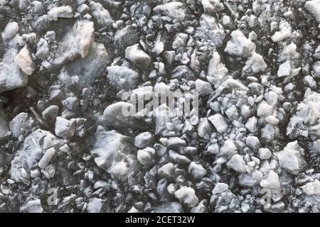 Top view of frozen pieces of ice, frozen fairway close with a lot of ice fragments, close up Stock Photo