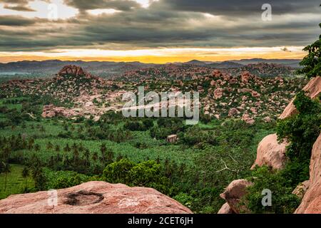 mountain sunrise with dramatic sky at morning flat angle shot image is taken at Matanga hill hampi karnataka india. it described as the Saint Matanga Stock Photo