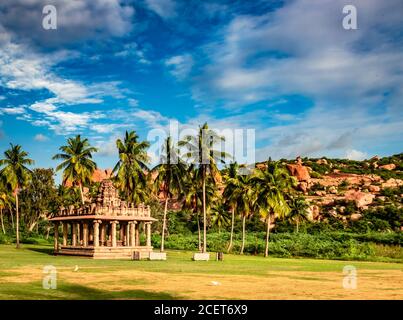 hampi ruins ancient breathtaking stone art with bright blue sky flat angle shot image is taken at hampi karnataka india. it is showing the impressive Stock Photo