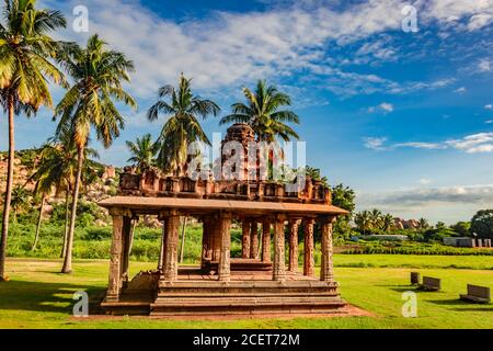 hampi ruins ancient breathtaking stone art with bright blue sky flat angle shot image is taken at hampi karnataka india. it is showing the impressive Stock Photo