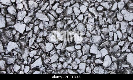Many small stones. Background of many black stones. The pattern caused by the arrangement of many stones for the background Black and wallpapers. Text Stock Photo