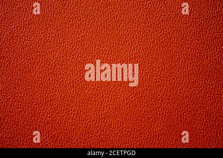 Texture of an orange plastic plate. The plate has an interesting pattern. Stock Photo