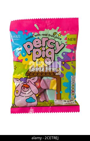 Bag of new Marks & Spencer percy pig party time sweets isolated on white background made with real fruit juice Stock Photo