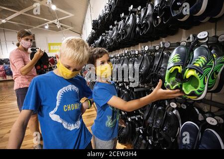 Back to School, a mother and sons buying their back to school shoes at a Clarks shoes outlet in Somerset, England, United Kingdom Stock Photo - Alamy