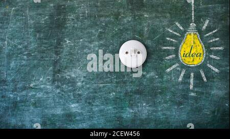 Idea, innovation, creativity,success concept with light bulb and switch on black board, design template,panoramic, large copy space Stock Photo