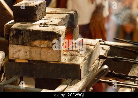 a burning forge made of bricks in nature Stock Photo