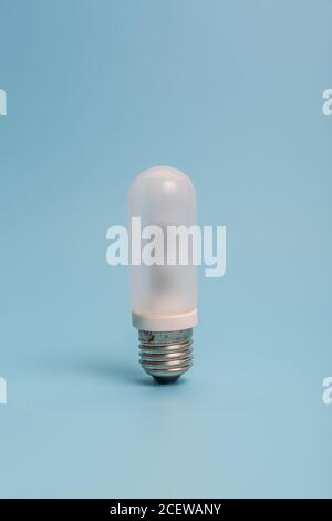 Glass bulb on blue background Stock Photo
