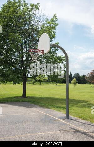 Basketball court with hoop, net and backboard in a city park Stock