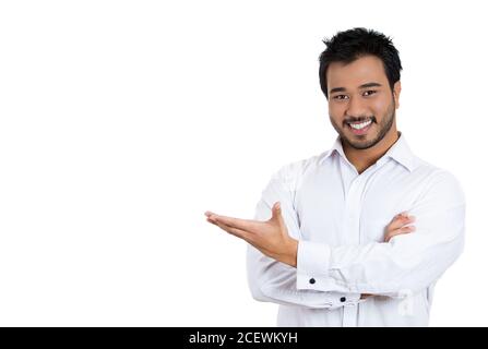 Closeup portrait of happy young smiling man with beard pointing to space at left isolated on white background. Positive human emotion signs symbol, fa Stock Photo