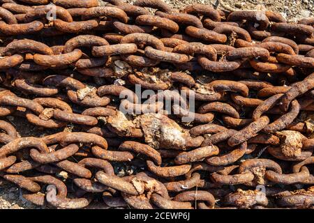 Old metal rusty anchor chain on sunset Stock Photo