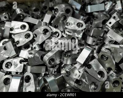 pile of shiny steel parts, full frame industrial background Stock Photo