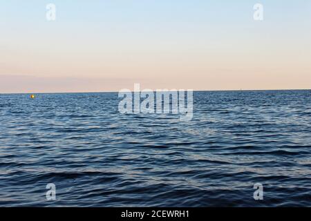 Beautiful deep blue Irish Sea at sunset from Pwllheli beach, North Wales Stock Photo