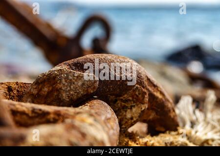 Old metal rusty anchor chain on sunset Stock Photo
