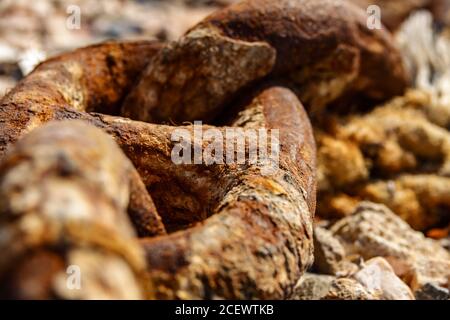 Old metal rusty anchor chain on sunset Stock Photo