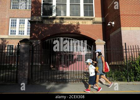 (200902) -- NEW YORK, Sept. 2, 2020 (Xinhua) -- People walk past a public school in New York, the United States, Sept. 1, 2020. New York Mayor Bill de Blasio announced Tuesday that the city's public school system's reopening will be postponed. (Xinhua/Wang Ying) Stock Photo